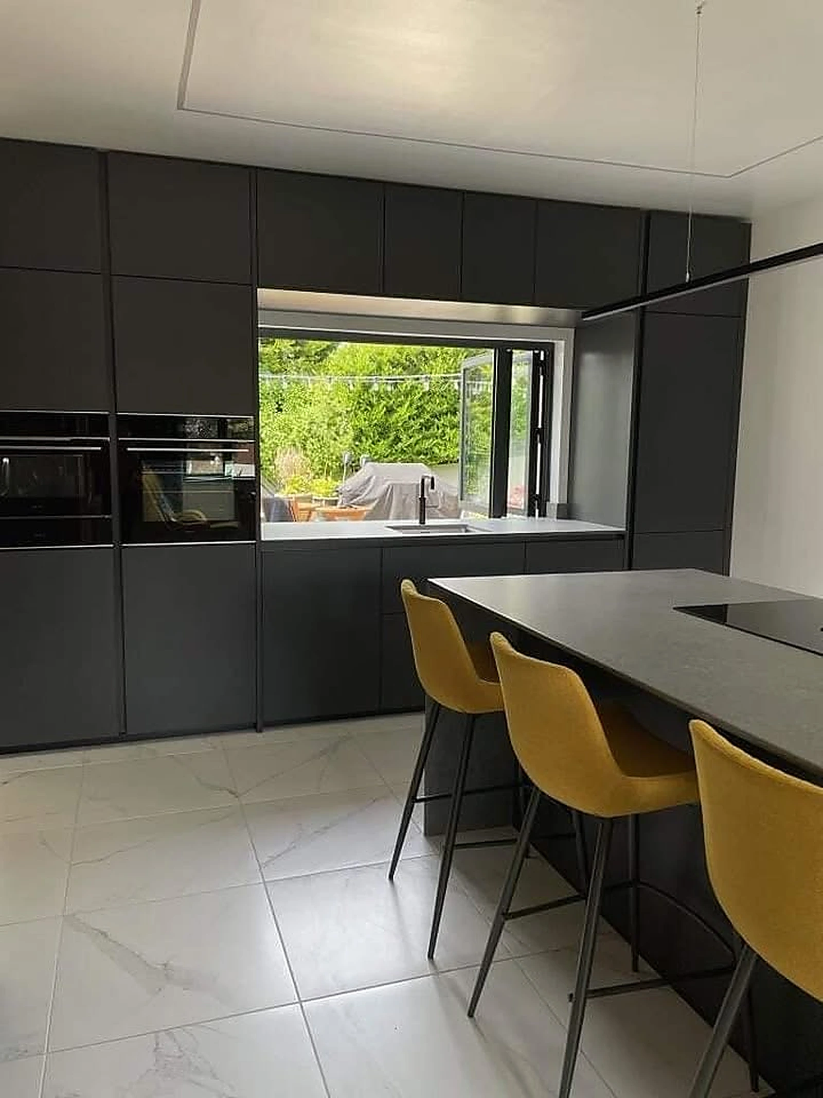 Aluminium window over a modern kitchen island