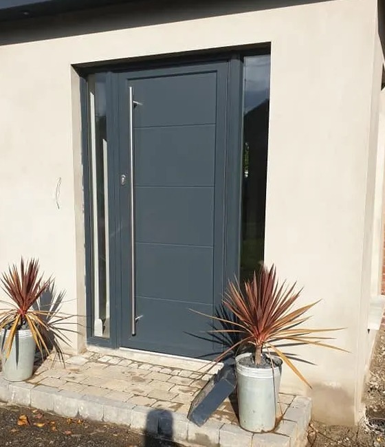 Grey aluminium front door with full-height bar handle and glazed side panels, Northern Ireland