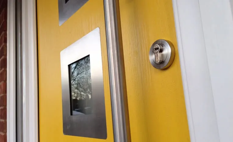 Yellow front door glazing and handle detail