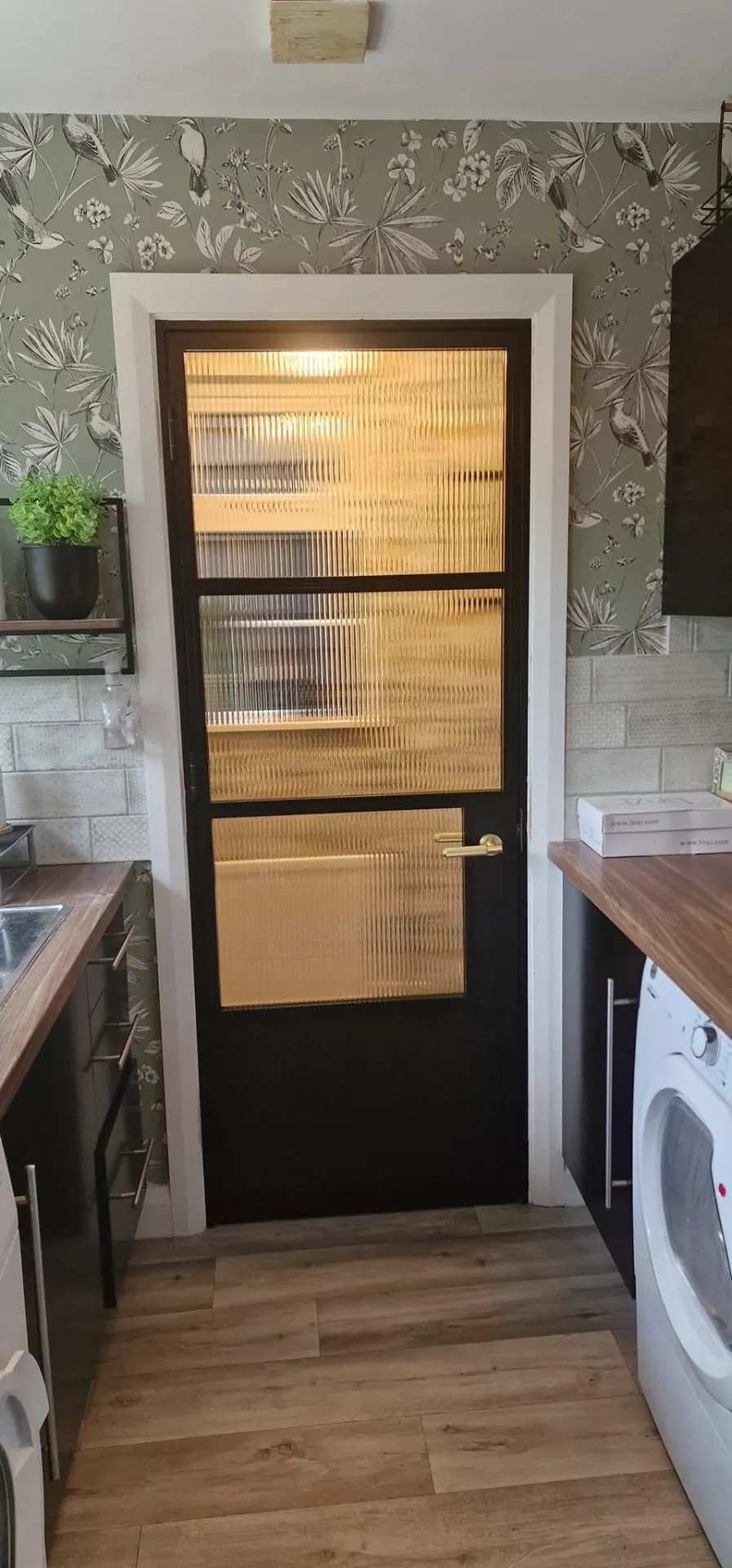 Single steel-look internal door with reeded glass in a kitchen