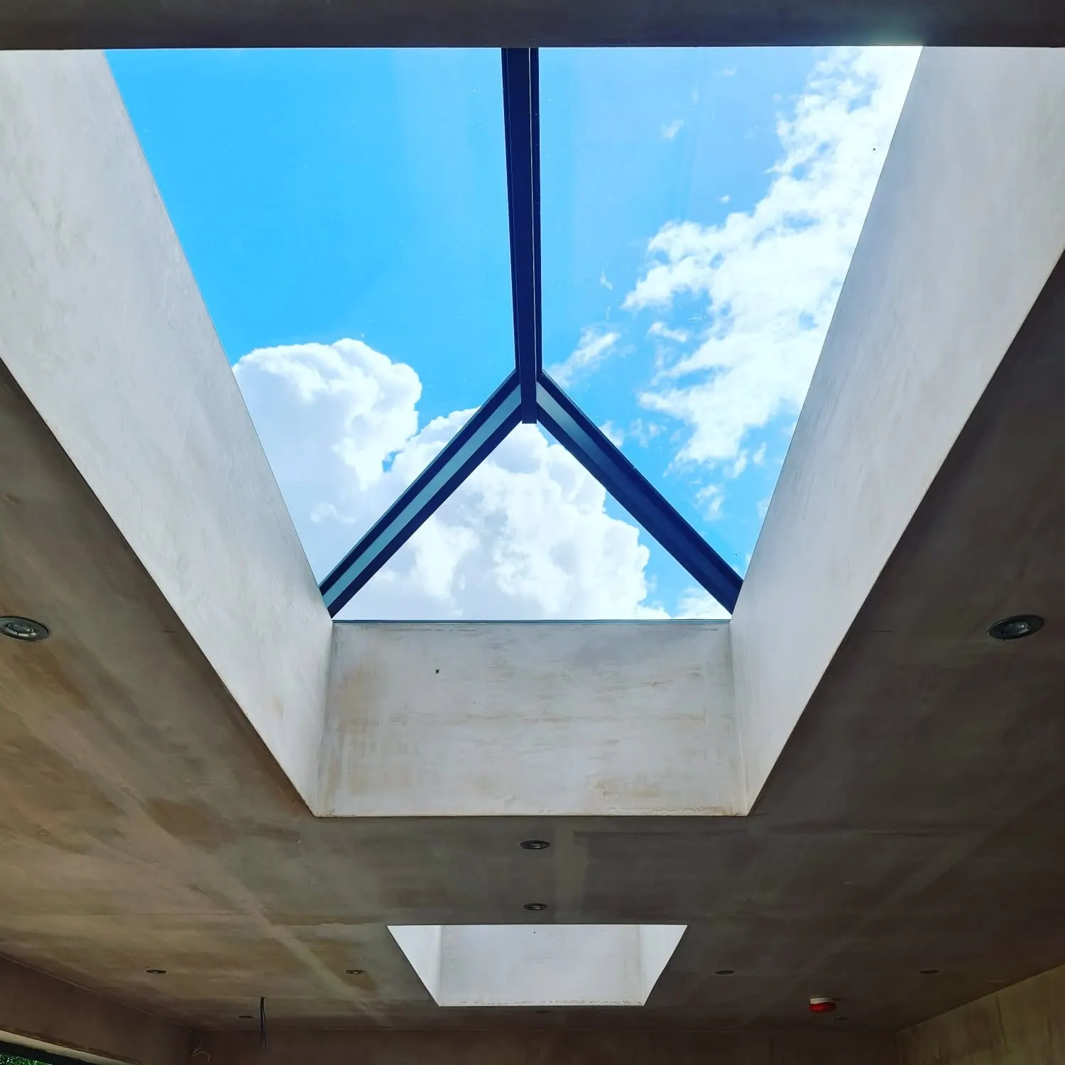 Roof lantern from inside showing sky and clouds